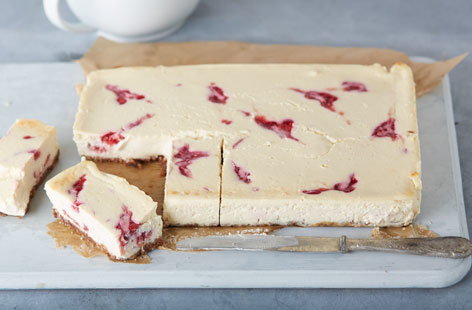 These luscious cheesecake bars feature all the flavour of elegance with layers of fresh swirled raspberries and crunchy chocolate cookies