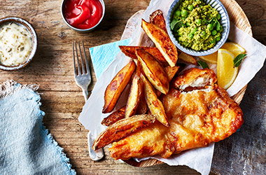 Beer-battered fish with mushy peas