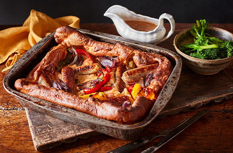 The whole family will love this twist on a classic. The batter is gently spiced with the warming flavour of Cajun seasoning and studded with roasted veg and veggie sausages.