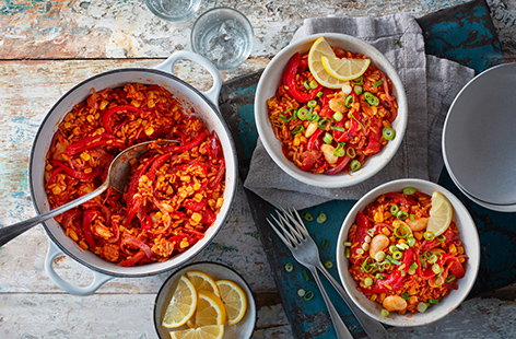 Make use of a few supermarket shortcuts to make this cheat's red pepper rice, ready in under 30 minutes. Spicy Mexican-inspired rice is filled with flavour, then add sweet ready-roasted peppers, sweetcorn and butter beans to a quick veggie dinner.