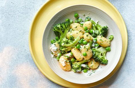 Get their greens in with this cheesy gnocchi dish - perfect for kids lunches during the half-term. This recipe is pretty versatile, so feel free to use whatever veg you have at hand.