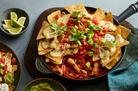 Everything you know and love about chicken fajitas – peppers, onions and chicken in a fragrant seasoning – but this recipe comes topped with tortilla chips and a good scattering of cheese