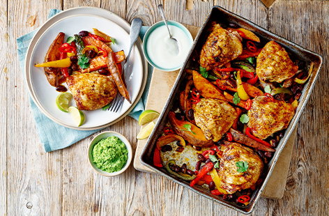 Merge two classic family favourites with this chicken fajita traybake