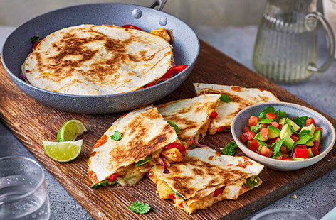 Looking for ways to use up roast chicken leftovers? Try these simple coronation-chicken inspired quesadillas