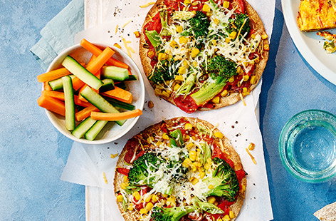 A packed-full-of-veg pizza recipe made easy with wholemeal tortillas instead of pizza dough; easy for you to make and fun for kids to eat.