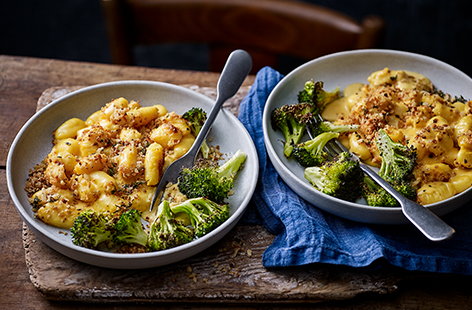 Try a twist on a classic with this gnocchi mac and cheese recipe. The traditional pasta shape is swapped out for pillows of soft gnocchi wrapped in a creamy two-cheese sauce and served with roasted broccoli for a comforting and quick midweek meal.