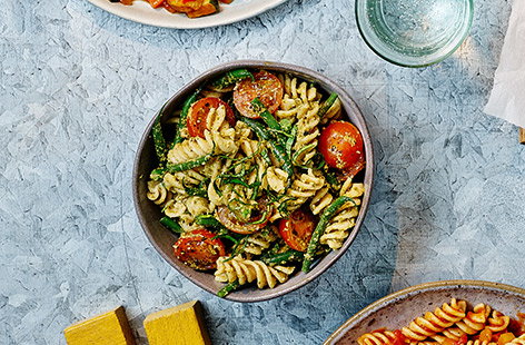 Adding green beans and cherry tomatoes takes this kids' pesto pasta recipe to the next level and packs in veg at the same time. 