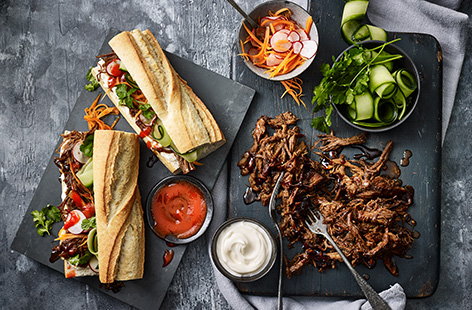 This indulgent slow-cooked hoisin pulled pork recipe is worth the wait. Pork is slowly cooked in an aromatic marinade of soy, ginger, honey and sherry until super tender and falling apart. Serve with colourful quick pickled veg and crusty baguettes.