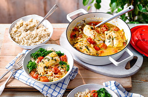 This simple Mediterranean fish stew recipe is a perfect summer dinner and easy way to cook fish. Cherry tomatoes cook down with plenty of basil for a fragrant sauce to poach the fish in - ready in under 30 mins for a healthy dinner idea.