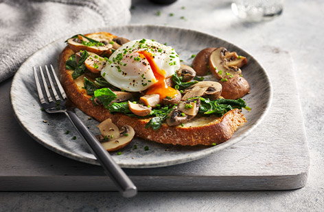 Serve up a cooked breakfast in under 10 minutes using just your microwave! Chestnut mushrooms and spinach are cooked in a moreish soy butter, then served on top of sourdough with a perfectly poached egg.