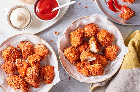 Try this fun popcorn chicken recipe for a quick midweek dinner that you and the kids will love. Bitesize bits of chicken breast are coated in crushed rice crispies, garlic and paprika before being baked in the oven in this simple recipe. 