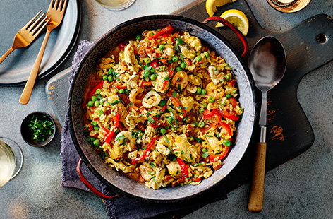 This simple paella recipe, for two people, adds fiery chorizo, tender chicken and a medley of seafood to saffron-infused rice.