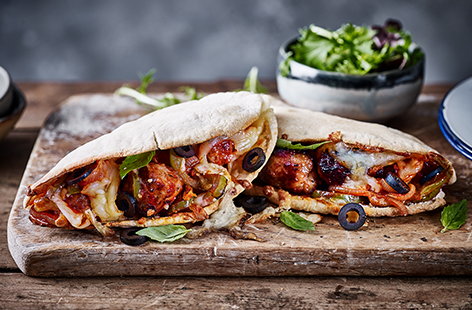 Pork and caramelised onion sausage meat adds a touch of meaty sweetness to these moreish pizza-style pittas.