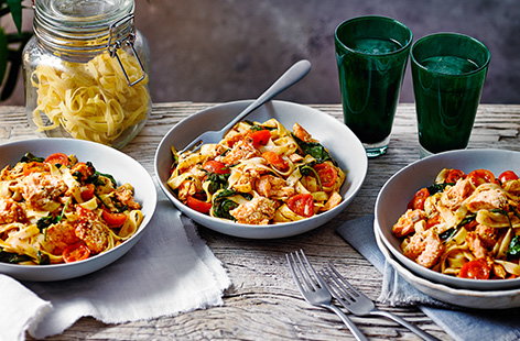 For a quick and easy midweek pasta recipe, try this sesame-crusted salmon harissa tagliatelle recipe. Salmon is baked with a sesame crust for extra crunch, then flaked into tagliatelle with a spicy harissa sauce and juicy cherry tomatoes.