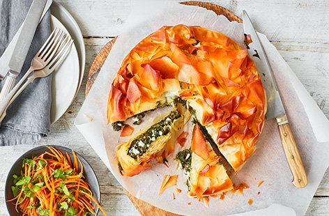 Bake this spinach and feta filo pie recipe for a hearty family meal - packed with veg, crumbly cheese and wrapped in crispy filo pastry. Serve with a fresh, herby carrot salad for dinner or pack up slices for a picnic lunch.