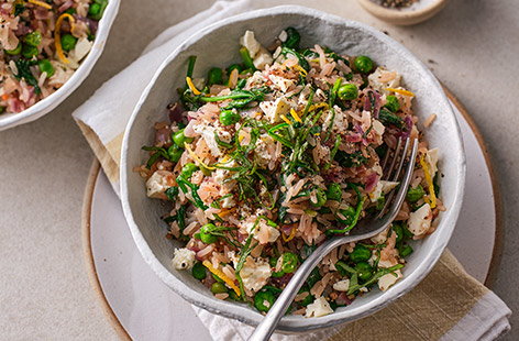 For those days when you want a quick and healthy risotto, step in this clever recipe that packs in the green veg and uses great-value salad cheese.