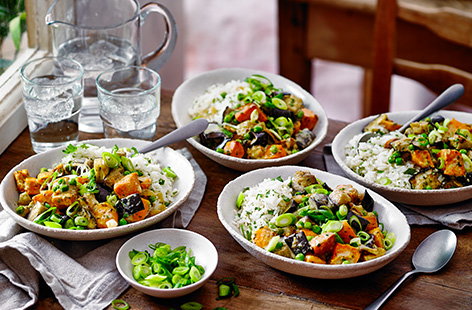 No stirring or simmering - let the oven do the work with this tray-roasted sweet potato and aubergine vegetarian curry recipe. The veg is roasted in Thai green curry paste until tender, before adding stock and cream into the roasting tin to make a rich sauce, for an easy one-pan dinner idea.