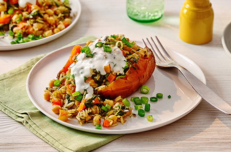 Make a cheat's biryani with spiced veg to top over baked sweet potatoes. Serve with a generous dollop of Greek yogurt for a low-effort family meal.