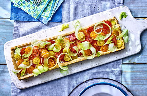 Bright tomatoes, creamy ricotta and ribbons of celery top this vibrant tart that's a winner for a summer lunch