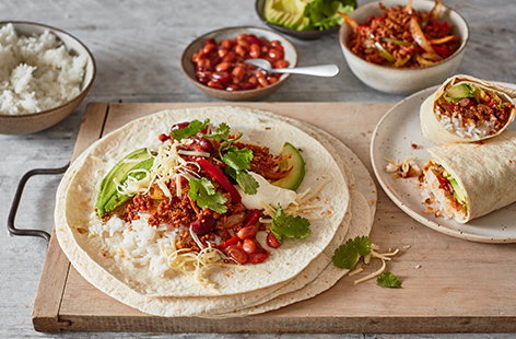 Get the whole family involved with this turkey burritos recipe. Set out the fajita-spiced turkey, spicy taco beans, cheese, avocado and rice and let everybody build their own burrito for a fun family dinner.