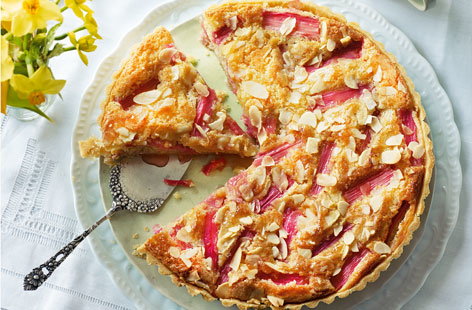 Bakewell tart is a classic British dessert that is well worth a try at home. Adding pretty pink rhubarb gives this elegant dessert a spring makeover, with a layer of sweet rhubarb compote and pink stems on top - serve with a creamy orange custard to finish