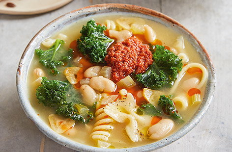 Jamie Oliver's vegan bean and pasta soup with sundried tomatoes is a great way to warm up on a chilly evening.