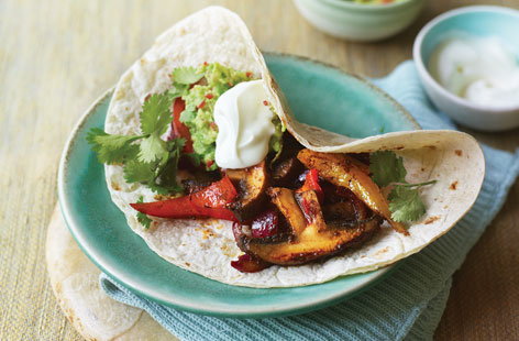 A vegetarian version of the classic Mexican feast, with crowd-pleasing homemade guacamole on the side. Spicy and filling, they're simple to cook and the family will adore them. Serve with sour cream, salsa and handfuls of tortilla chips.