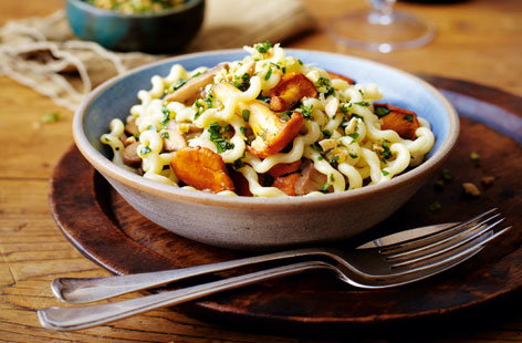 Celebrate autumn's wild mushroom bounty with this elegant pasta dish for four. Parmesan, garlic, parsley and two types of mushroom are softened and gently tossed with toasted almonds and fusilli lunghi for a comforting supper, ready in half an hour.