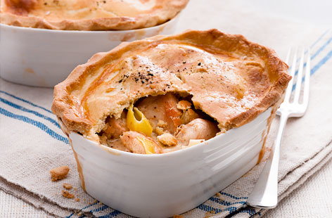 Recreate tasty pub-grub at home with these easy chicken and leek pot pies. To cook, leeks and the chicken are simmered in cream and mustard before being spooned into individual pie dishes, covered with shortcrust pastry and baked until golden. Serve with mash.