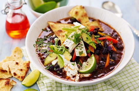 This rich soup is packed with fiery flavour, with creamy black beans, zesty lime and crispy corn tortilla strips