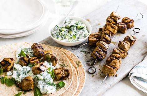 These classic Greek kebabs are the ultimate fast food. Succulent pork is given a serious flavour kick with a lemon and cumin marinade, before being griddled until golden and served on toasted flatbreads with a hearty dollop of refreshing tzatziki