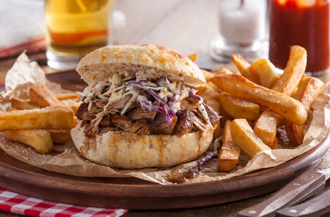 This gorgeous sandwich is filled with mouthwatering meat and a crunchy slaw