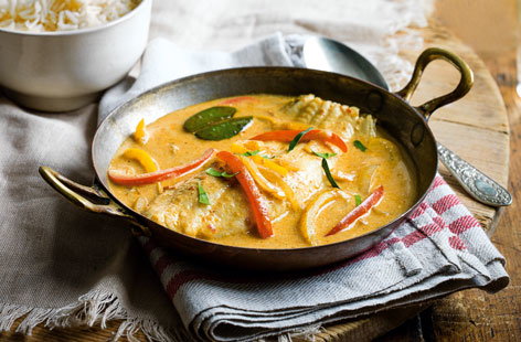 For an elegant fish curry worthy of a dinner party, use whole lemon sole fillets. This Malaysian-inspired recipe is made with coconut milk and fragrant Rendang curry paste. The fish poaches in the sauce a matter of minutes, so make sure your rice is ready at this stage.