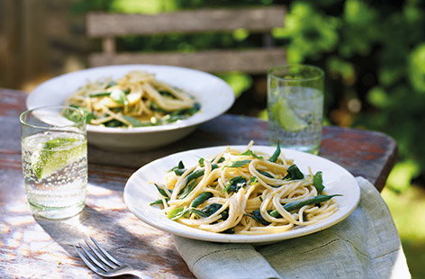 This clever spaghetti recipe uses tinned beans to make a super-quick, creamy dairy-free sauce to coat the pasta. Flavoured with lemon and garlic, this easy vegan pasta recipe is also packed with summer veg for a filling midweek meal.