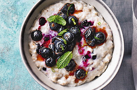 Brighten up your morning with a beautiful bowl of blueberry and coconut porridge