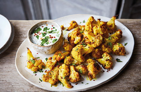 Stick to your healthy resolutions and snack on this easy cauliflower popcorn recipe. Simply toss florets in chilli and spices and roast until crisp for a savoury snack that's perfect for sharing, just add your favourite dip for dunking.