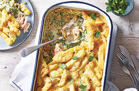 Try a new twist on fish and chips with this surprising fish pie recipe with spring onions, parsley and peas