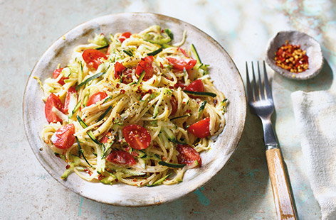 This colourful courgette spaghetti recipe is simple to cook and full of fresh flavours. Grating the courgette is super-easy and means it doesn’t need to be cooked separately – simply stir into the pasta with juicy cherry tomatoes and creamy ricotta.