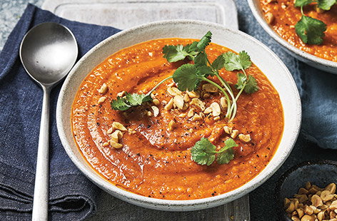 Enjoy all of the classic flavours of a creamy korma curry in this aromatic sweet potato soup recipe, made with crunchy peanut butter and warmly spiced with fragrant ginger, coriander and garlic