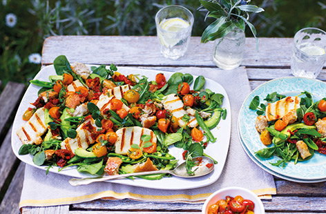 Grilled halloumi cheese and crisp, Parmesan croutons make this vibrant salad feel hearty and substantial. Served with a delicious warm tomato and chilli dressing, this salad is packed full of flavour too.