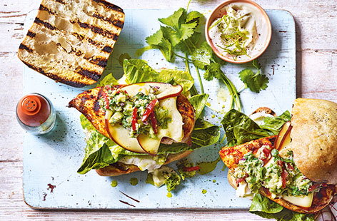 Grab a taste of Mexico with these spicy chicken burgers. Piled high with colourful guacamole, tangy lime mayo and melting smoked cheese, these are an irresistible summer supper, ready in just 30 minutes.