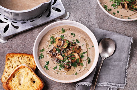 Silky smooth mushroom soup is comfort food in a bowl, perfect for cold winter nights. Top with golden fried mushrooms and a drizzle of oil for a fast, vegetarian dinner. Learning how to make mushroom soup really couldn't be easier!