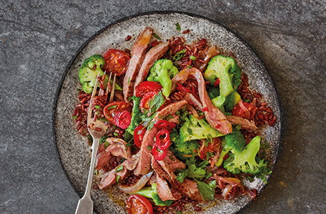 Nutty red rice pairs brilliantly with this fiery spiced lamb dish, which is made with chilli and topped with tzatziki.