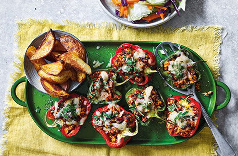 Packed with herbed turkey mince and topped with melting cheese, these stuffed peppers are a dinner to look forward to. Serve with a crunchy raw slaw and crisp roast wedges for a family feast.