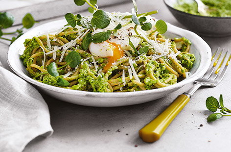 This summery spaghetti recipe takes classic pasta and pesto up a notch. Homemade pesto is easy to blitz together in minutes – this twist uses peas and peppery watercress for a vibrant sauce. Top with a poached egg for a decadent finishing touch.