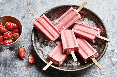 Cool down this summer with this easy vegan strawberry ice lolly recipe. Creamy coconut milk and fresh strawberries are blitzed together for a pretty vegan dessert that everyone can enjoy.