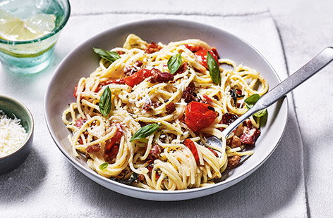 Upgrade classic carbonara with sweet roasted cherry tomatoes – the perfect family dinner idea for celebrating the warmer weather