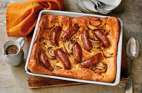 Family dinners don't get much more comforting than a classic toad-in-the-hole. Fluffy Yorkshire pudding batter paired with hearty pork sausages, alongside a generous serving of rich onion gravy – all you need to add is your favourite veg on the side. 