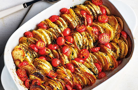 This tasty potato bake with tangy cherry tomatoes and fragrant oregano is the ideal side dish recipe for an Easter feast or Sunday roast