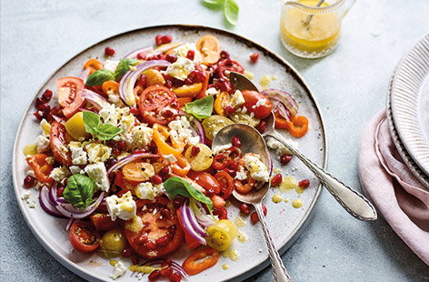 Embrace salad season as the weather gets warmer again. This colourful tomato, feta and pomegranate salad works as a fresh and healthy lunch with crusty bread, or as an easy side to serve with grilled meat, fish, tofu or whatever you fancy. Dish up on a big